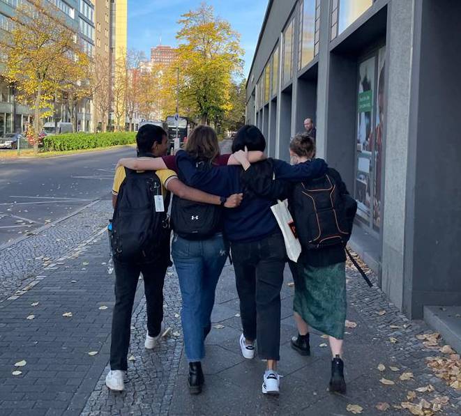 Four Pinceton students walking down the street in Berlin