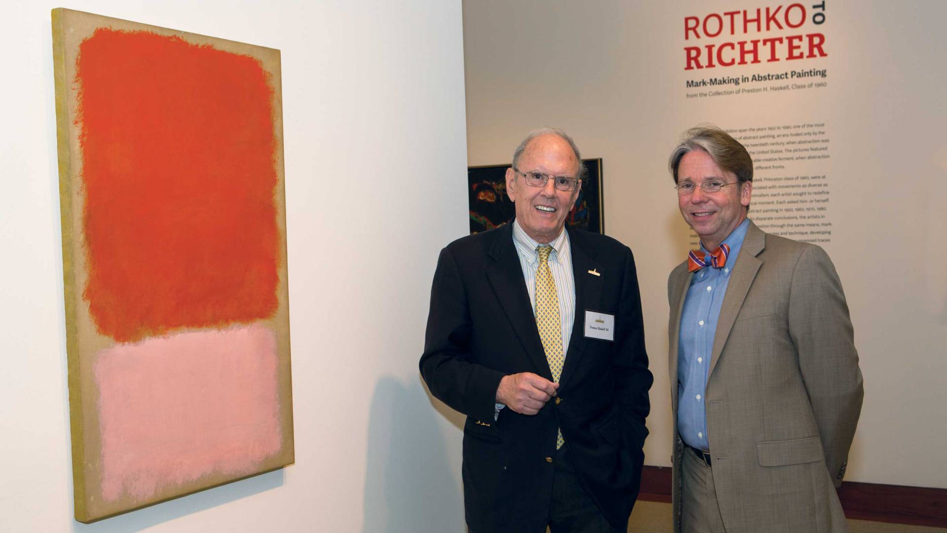 Preston Haskell and James Steward stand next to a painting by Mark Rothko