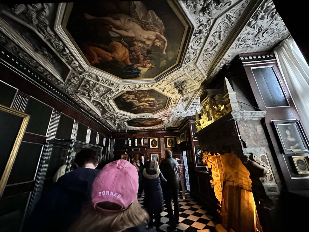 Walking under a ceiling with paintings