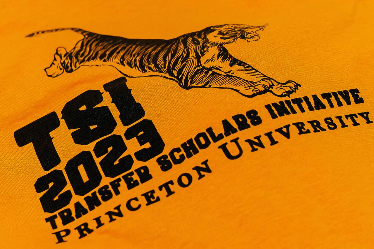 Orange shirt with the TSI logo.