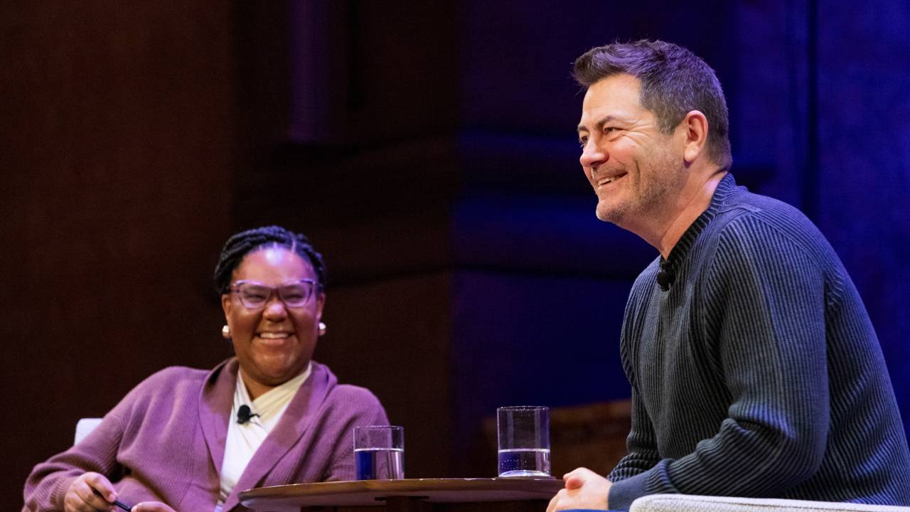 Emmy-award winning actor, comedian, writer and producer Nick Offerman (right) shares a laugh with Mell Thompson (left), associate dean of undergraduate students, during the "Beyond the Resume" conversation in Richardson Auditorium on Jan. 26. 