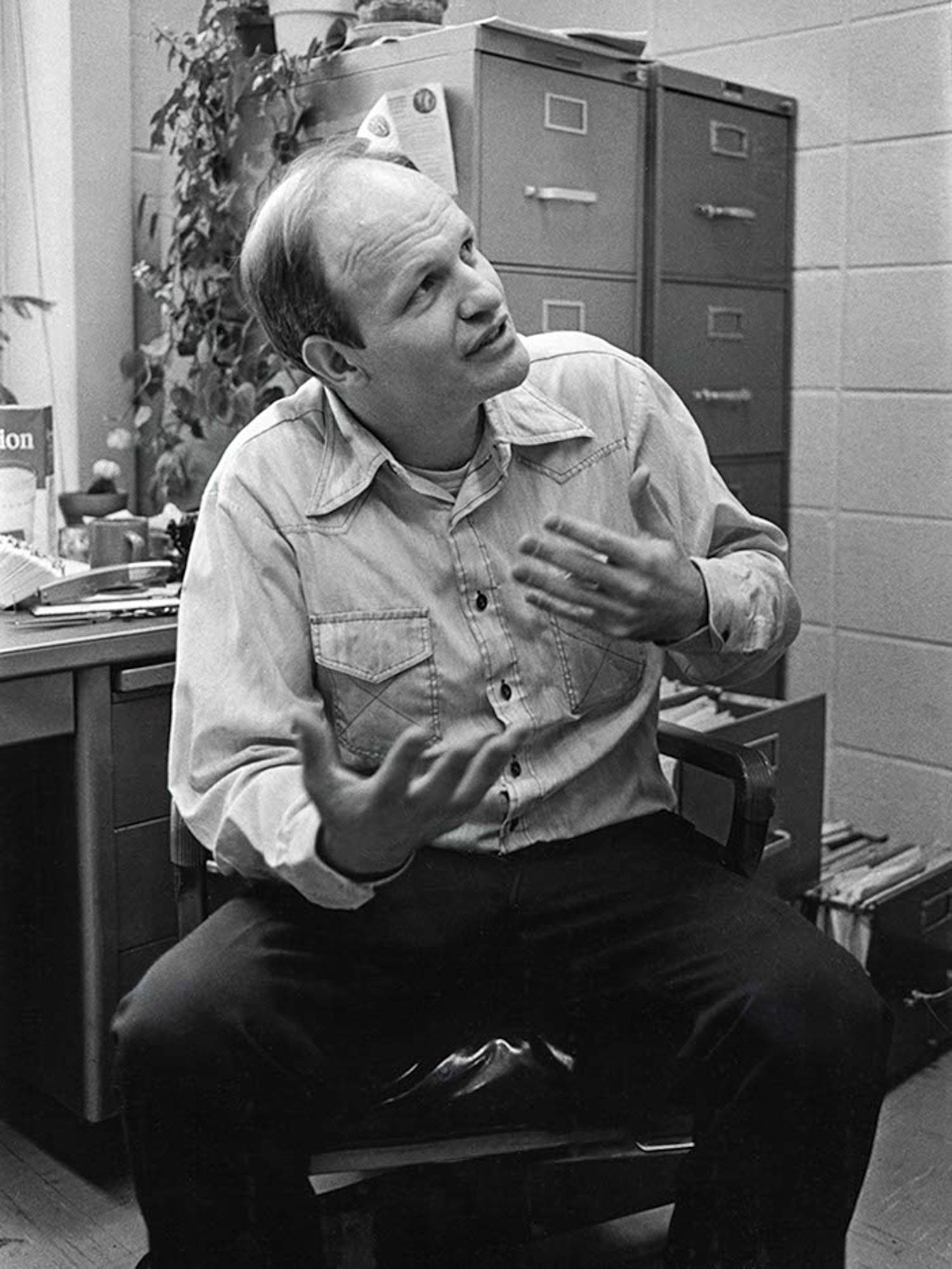 In this black-and-white photo, a young Frank von Hippel talks animatedly with his hands to someone off camera. Years later, he remains active with the program.
