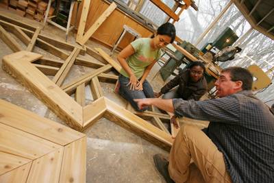 Wey and Kaneene receive guidance from John Hunter