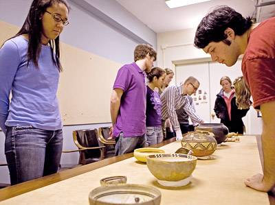 Students examining bowls