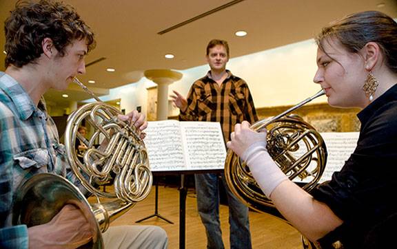 Chris Komer working with students