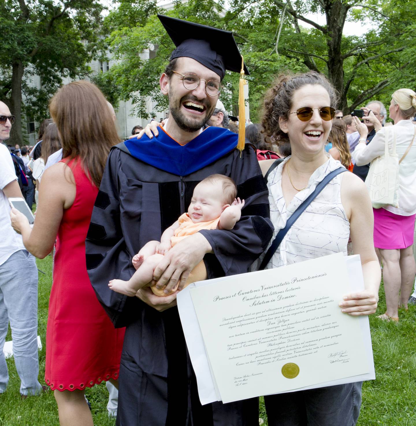 Dan Zeltzer, who earned a Ph.D. in economics, celebrates his graduation with his wife, Efrat Kedem, and their 3-month-old daughter, Amalia