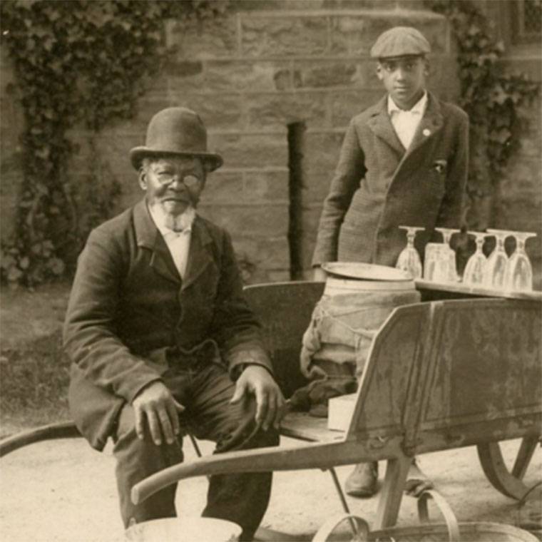 James Johnson sitting by car circa 1890