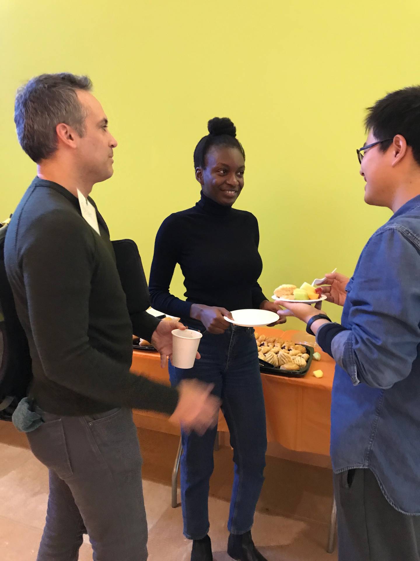 Three people in conversation