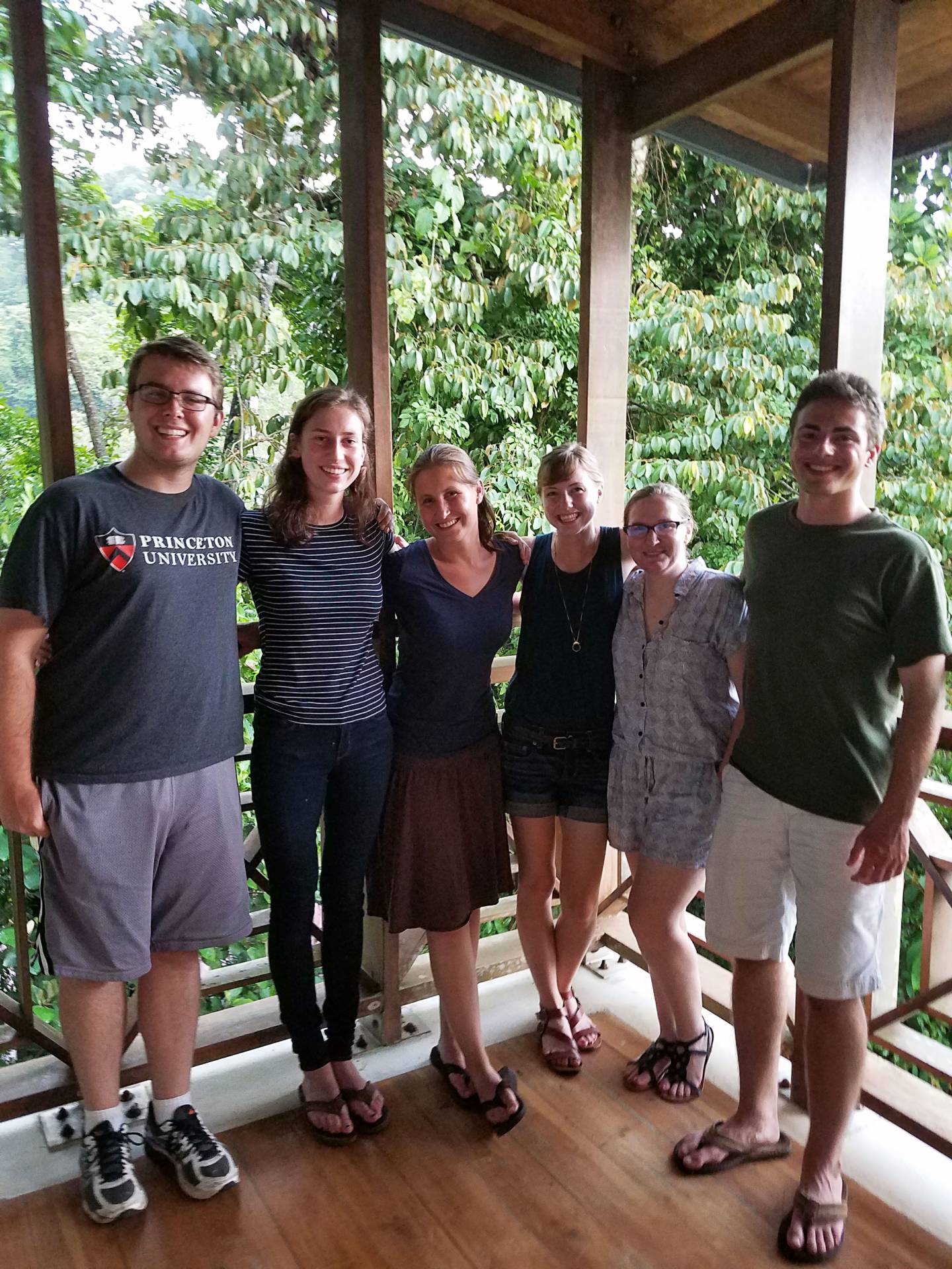 Group of Princeton researchers standing together in the forest