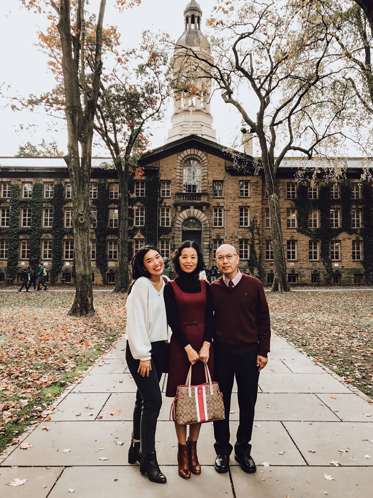 Lucy Chuang and her parents in front of Nassau Hall