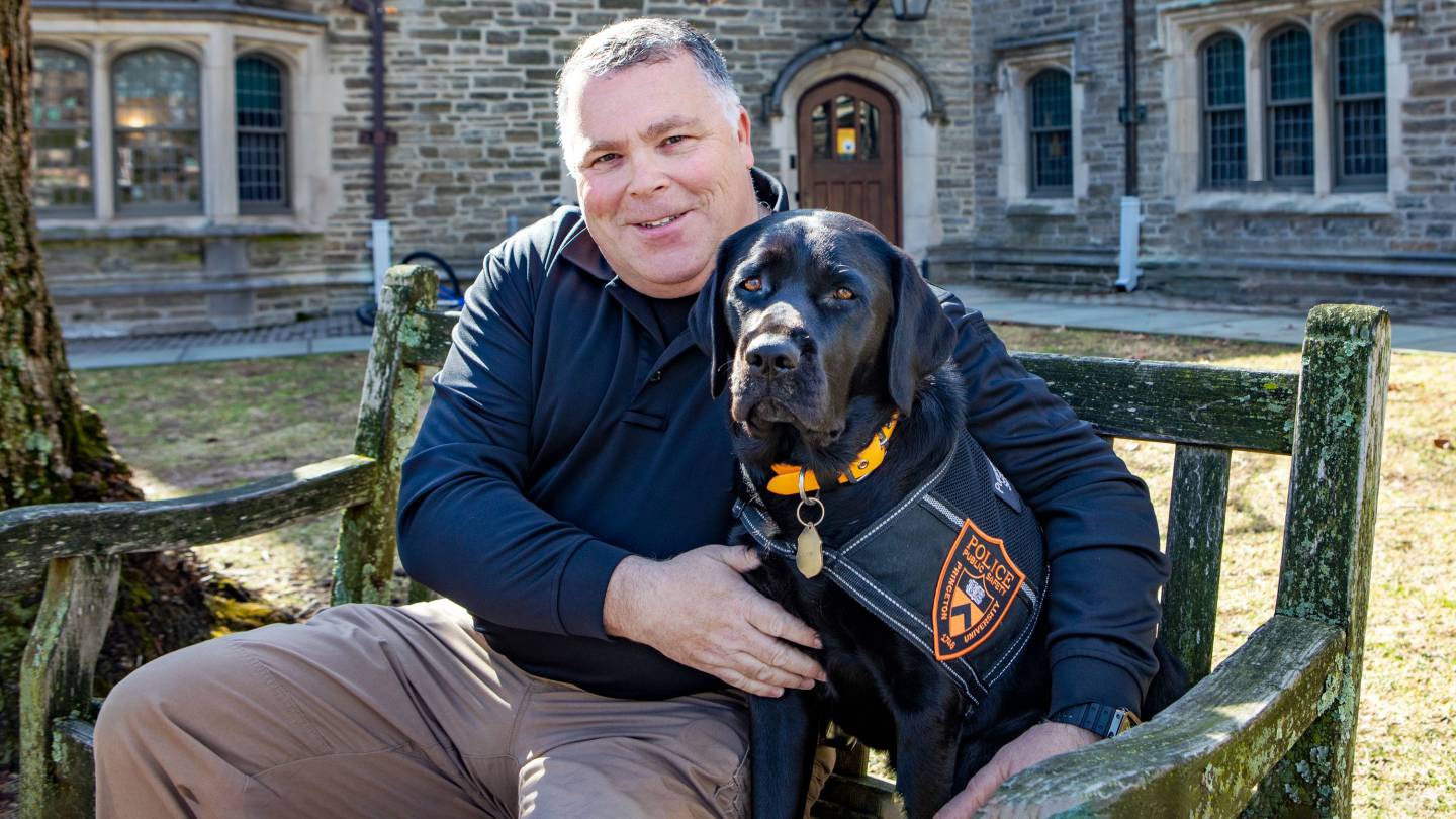 Meet Coach, the University's first full-time therapy dog (and her human  'forever handler')