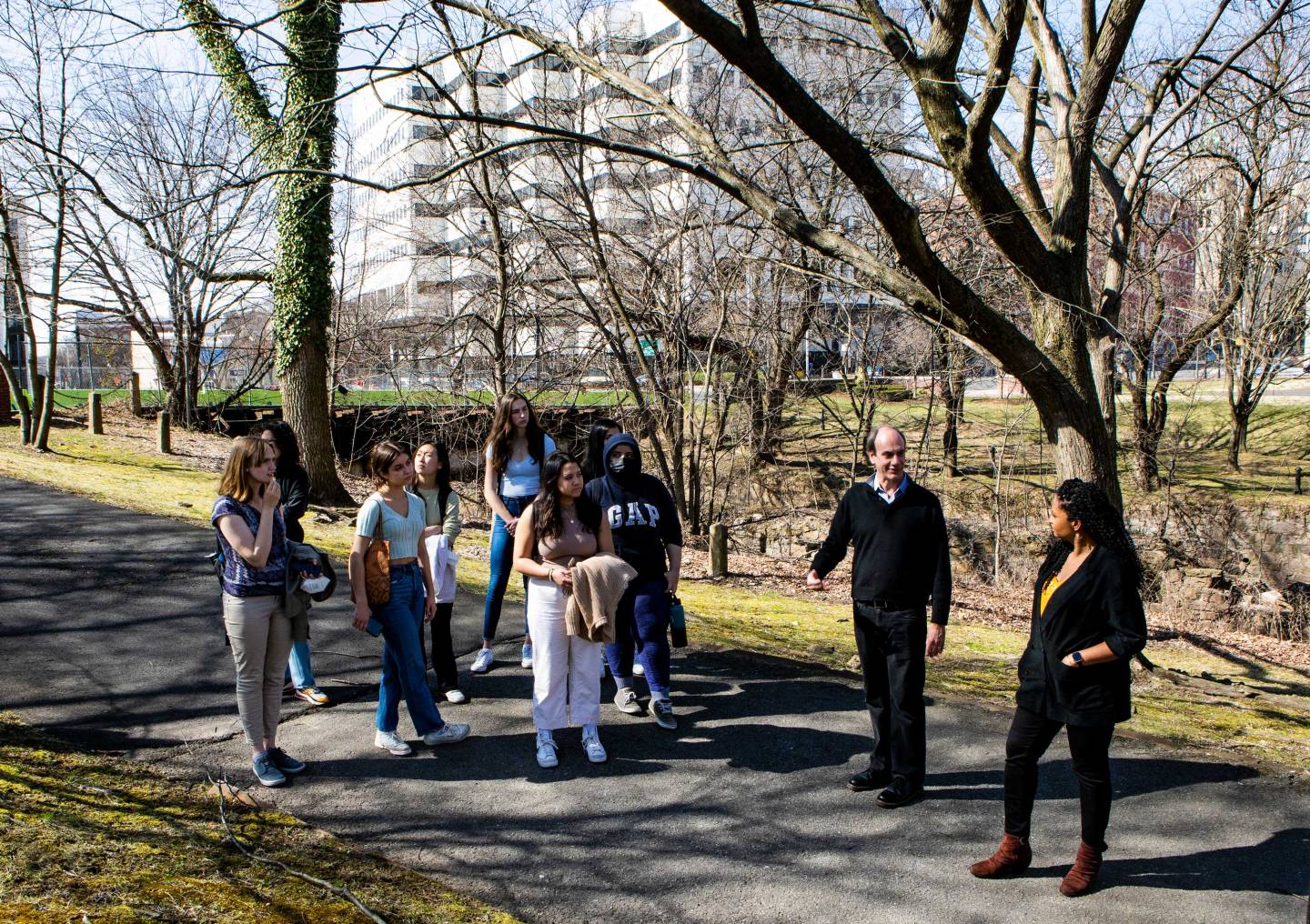 2 professors lead a group of students throuh a tour of Trenton