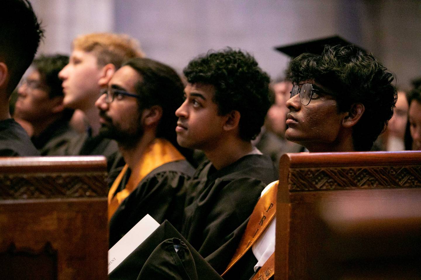 Students listen in the pews