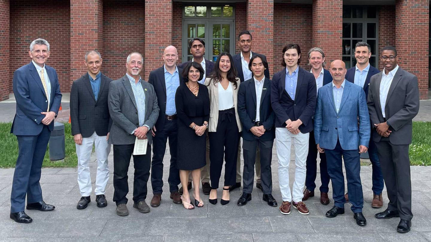 People in town council pose with newly minted firefighters