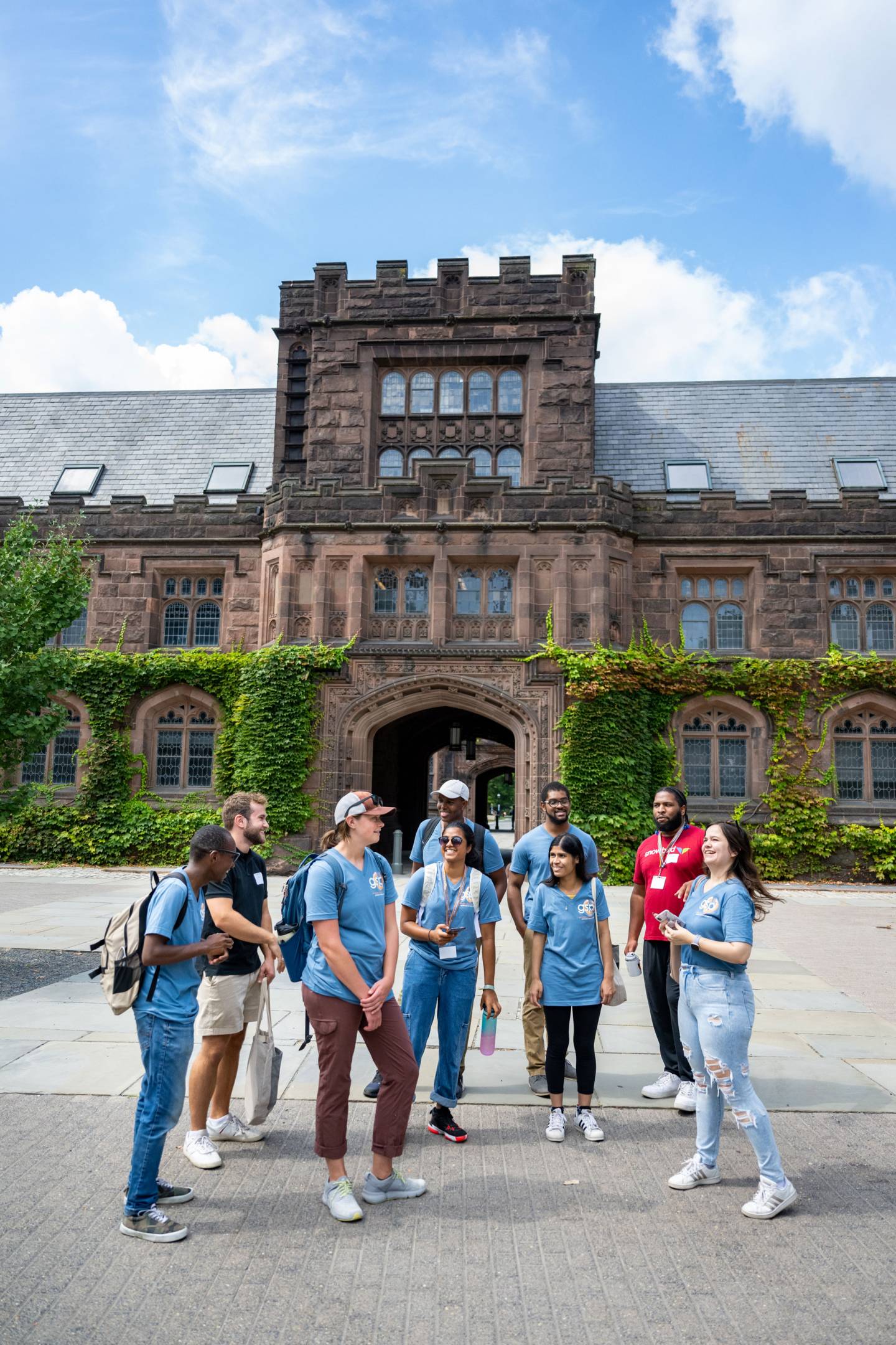 A group of graduate students gather outside East Pyne