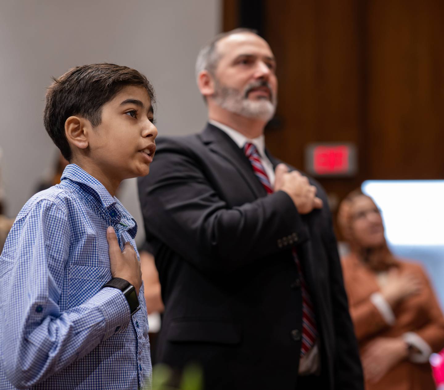 Aarush Tripathi, 13, joins Keith Dorr of U.S. Citizenship and Immigration Services