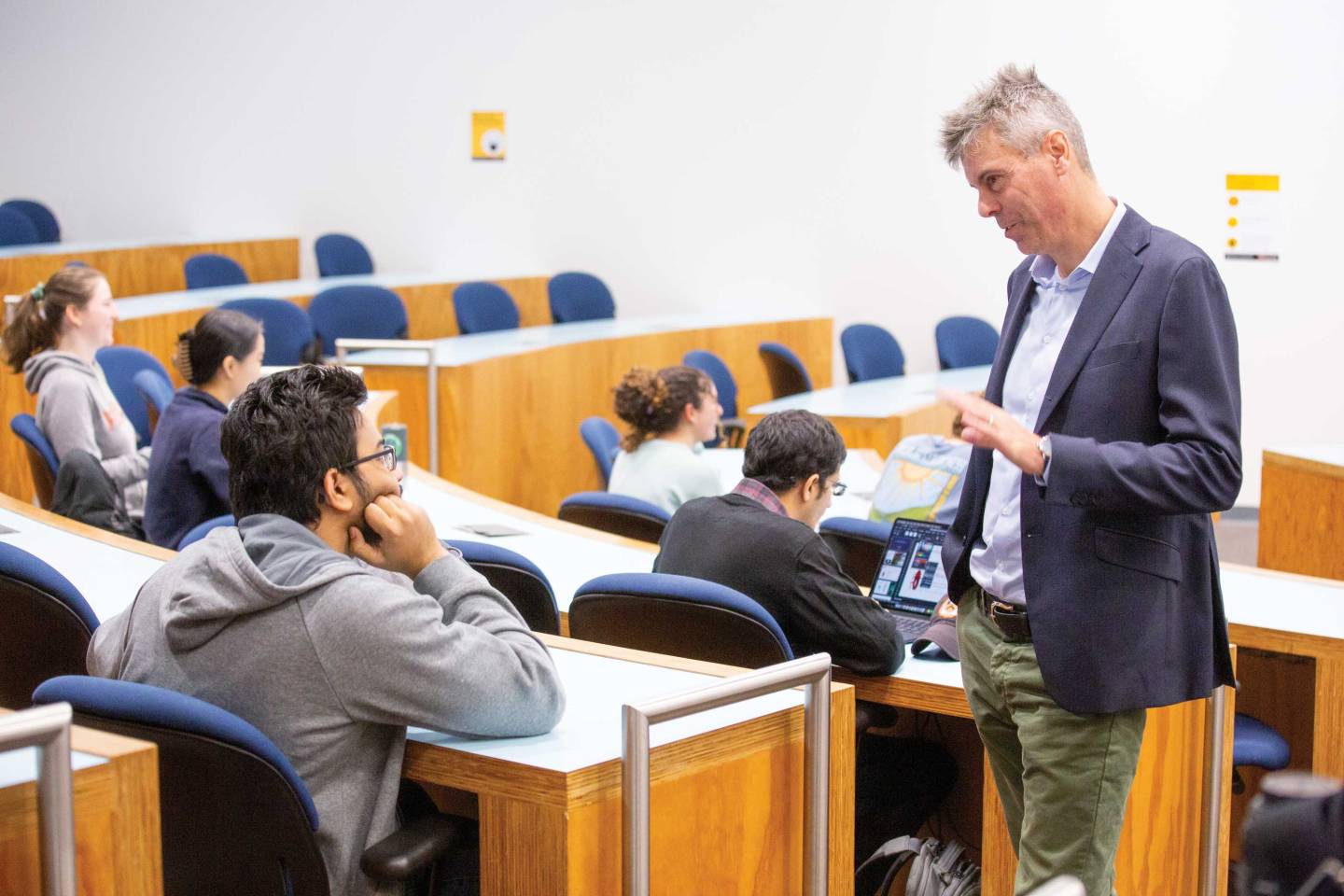 Prof Scholes talks to a student