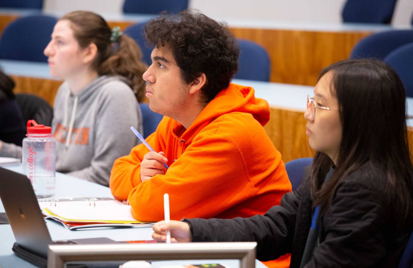 Students listen intently in a lecture hall