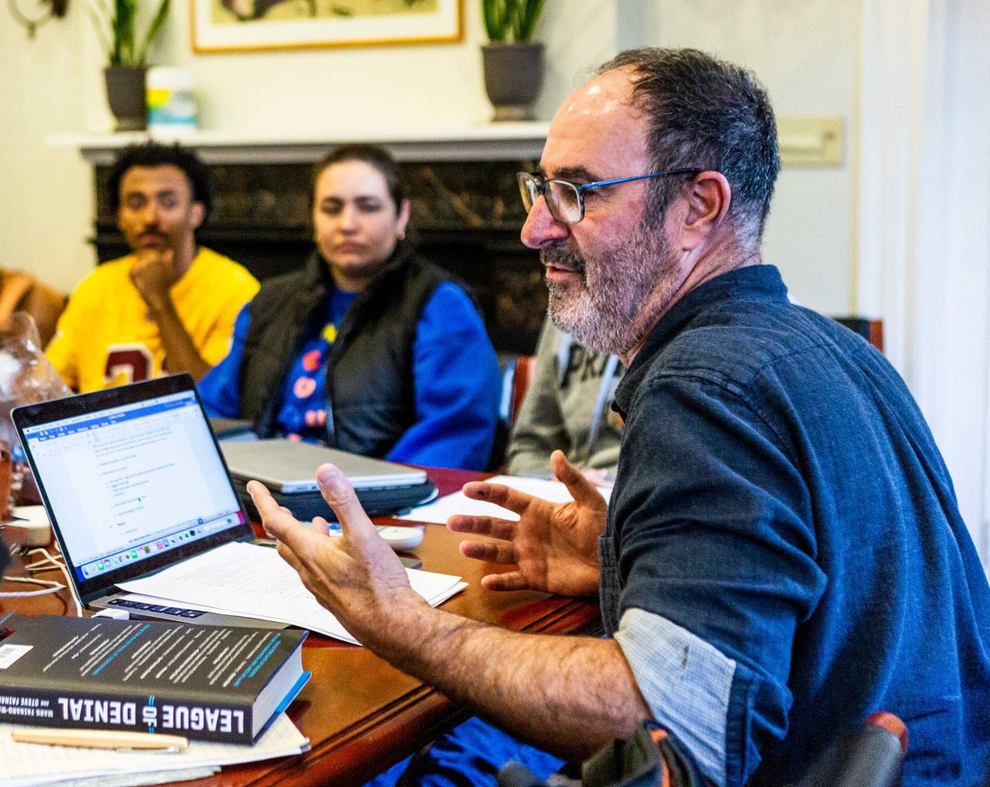 Steve Fainaru gesticulating while teaching his class