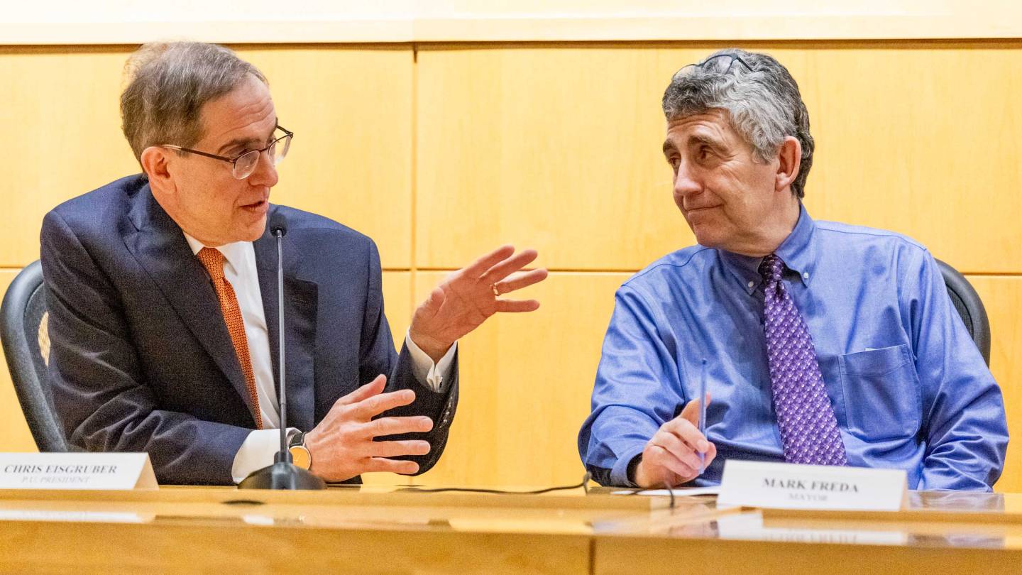 President Eisgruber gesticulates during a town hall meeting with Mark Freda