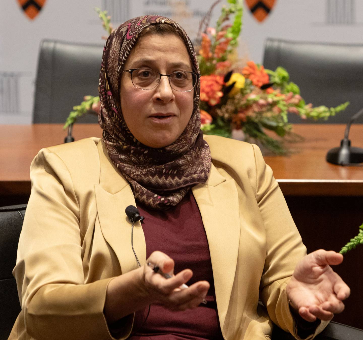 Amaney Jamal talking while seated on the stage of the Arther Lewis Auditorium in Robertson Hall