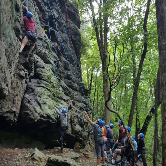 Students climbing rocks at Coopers Rock State Forest in West Virginia