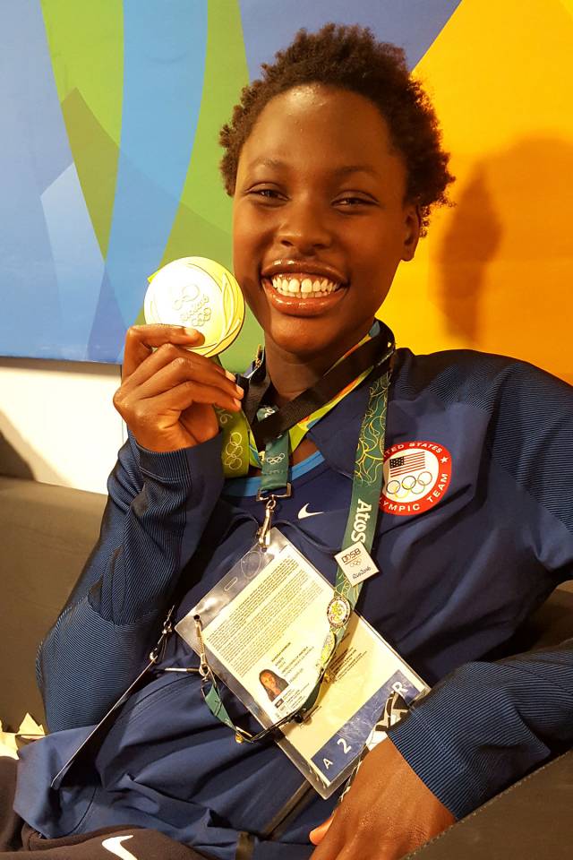athlete shows off her medal