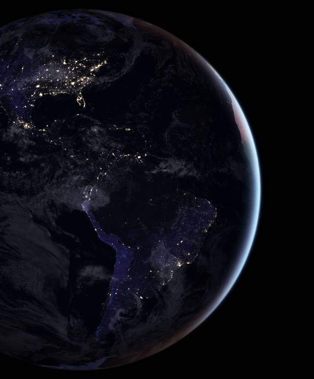 Earth at night with electric lights visible