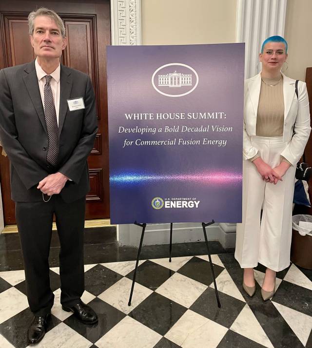 Steve Cowley and Amelia Chambliss in front of a sign that reads, "White House Summit: Developing a bold decadal vision for commercial Fusion Energy"