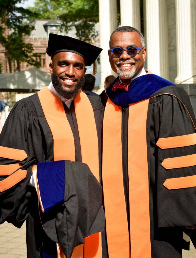 A professor and his advisee before the Hooding ceremony