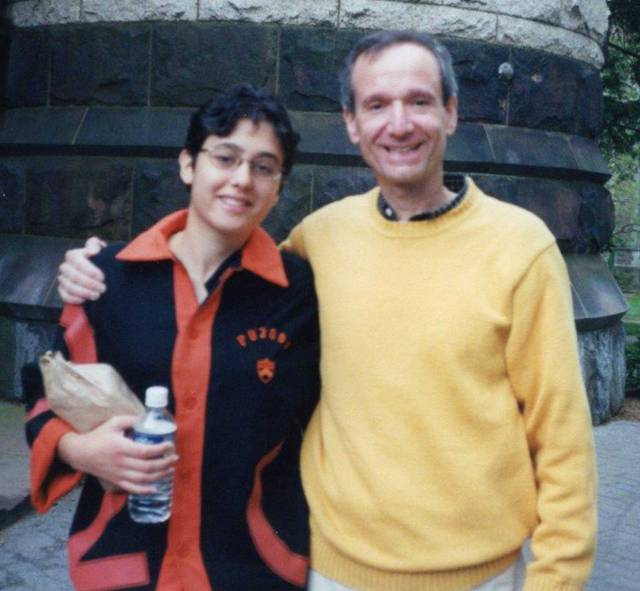 Leah Boustan in her class jacket with her father on campus