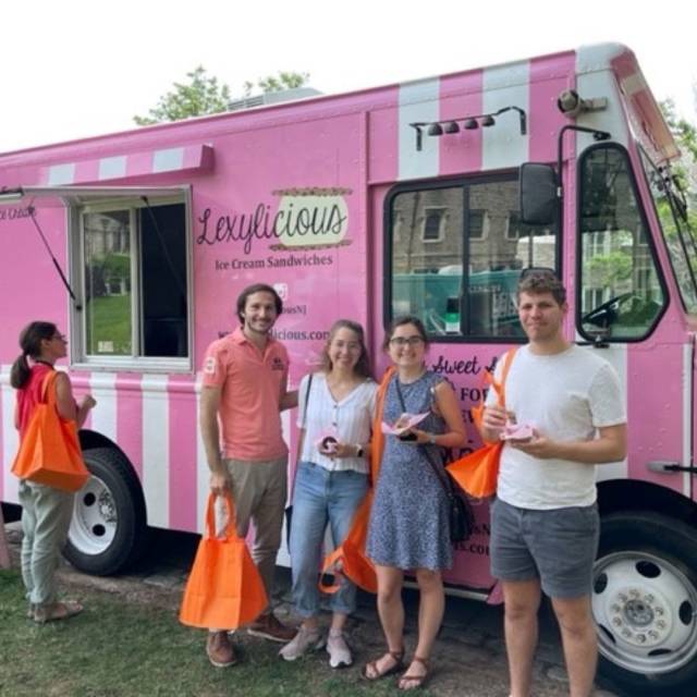 New employess gather for an event with an ice cream truck