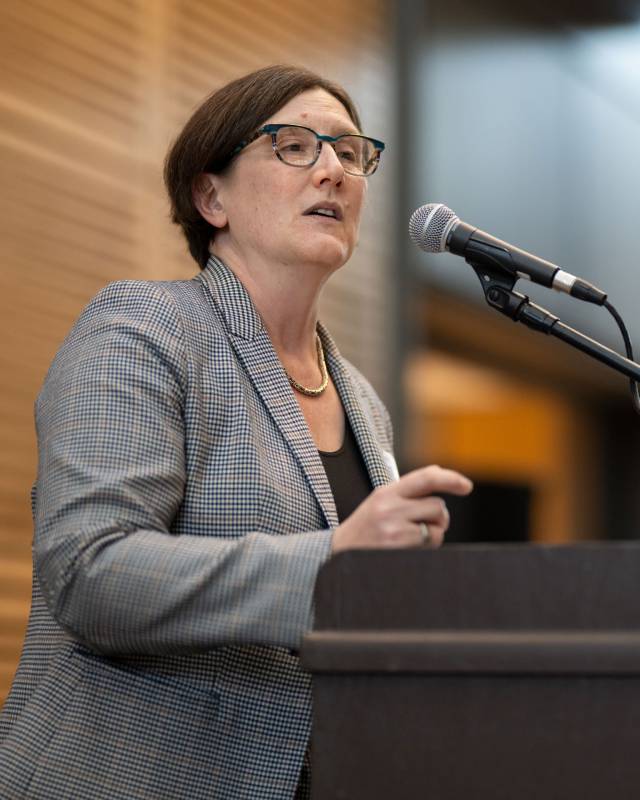 University Provost Jennifer Rexford speaks into a microphone at the podium
