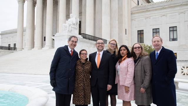 Group standing on courthouse steps