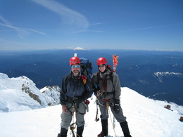 Andy and Dave Standing on Summit of Mt. Hood with other volcanoes in background